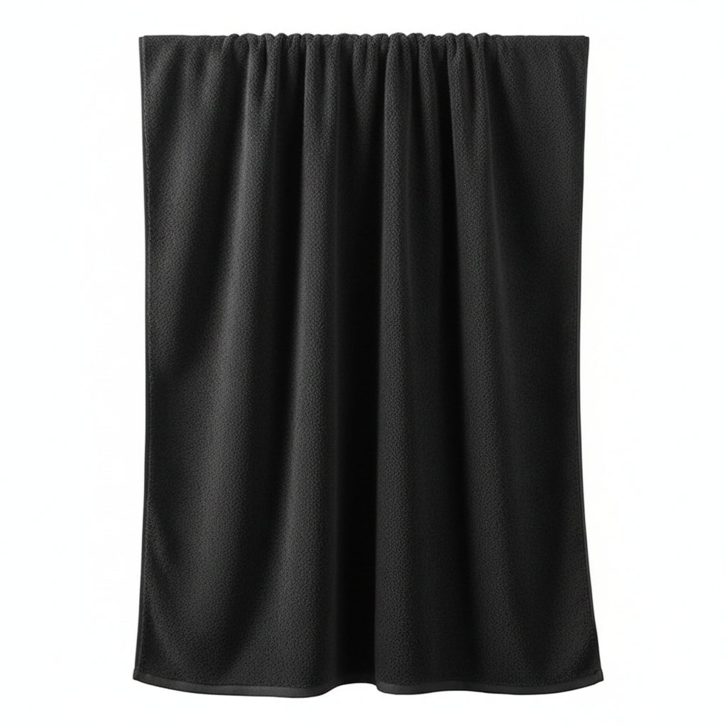 Dark gray towel hanging on a rod against a blue wall with decorative elements.