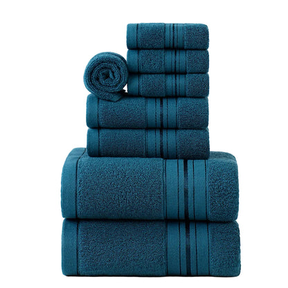 Set of blue towels stacked on a light gray background