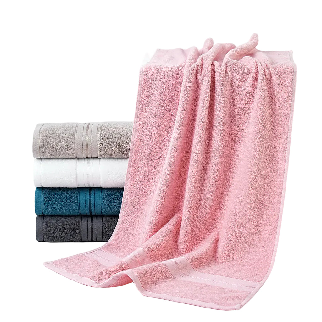 Stack of folded towels including pink, gray, white, and blue on a white background