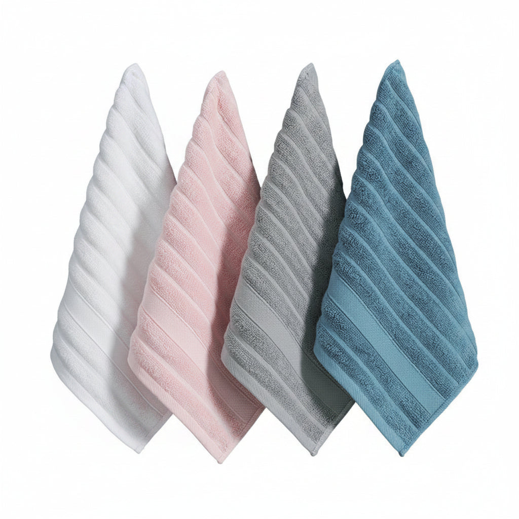 Four textured towels in white, pink, gray, and blue hanging on a wooden rack against a dark blue background.