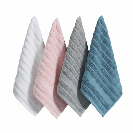 Four textured towels in white, pink, gray, and blue hanging on a wooden rack against a dark blue background.