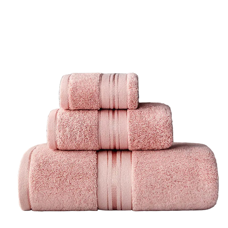Stack of pink towels on a dark background