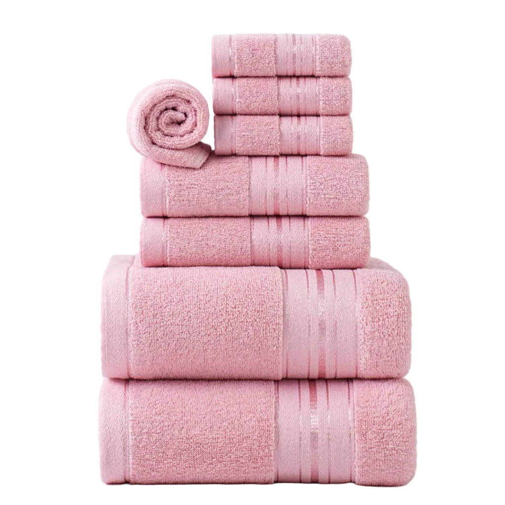 Stack of pink towels on a white background