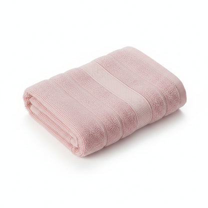 Stack of pink towels on a dark blue background