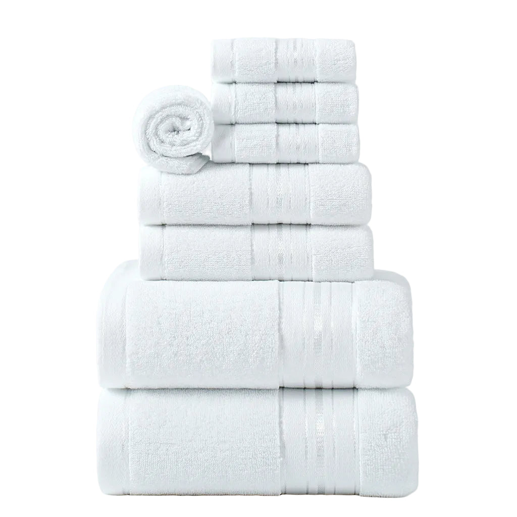 Stack of white towels on a light gray background