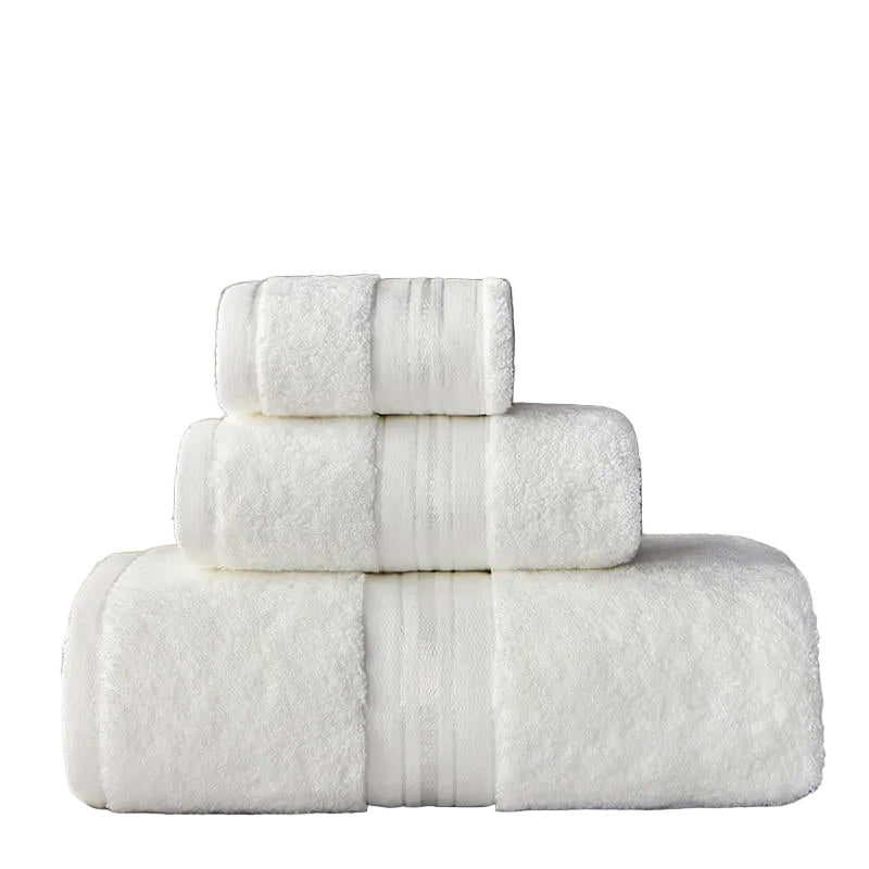 Stack of white towels on a marble surface with a dark background